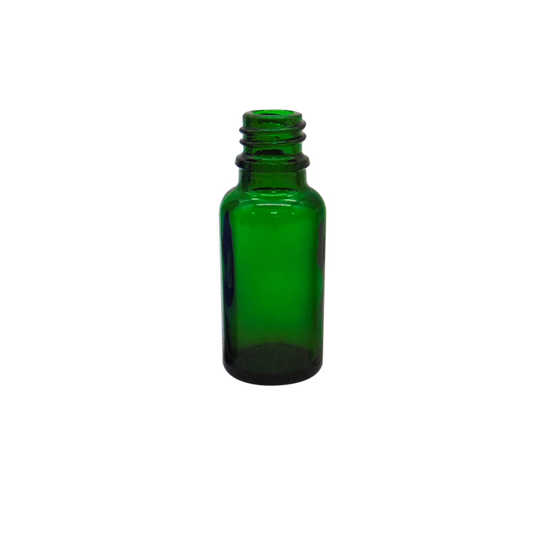 green essential oil glass bottle