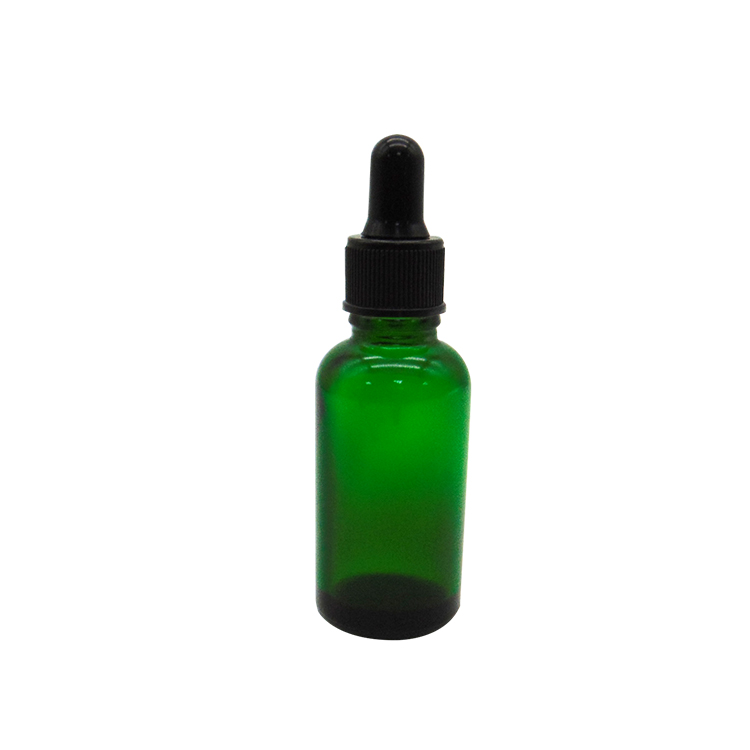 glass bottle with lid essential oil green